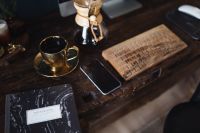 Kaboompics - Notebook, cup of coffee, glasses, Chemex, keyboard, iPhone