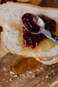 Kaboompics - Close-Up Toast Spread With Raspberry Jam and Honey