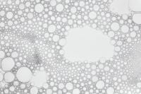 Kaboompics - Macro White Liquid Bubble Texture with a Wide Oval Opening, Horizontal Background
