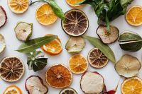 Kaboompics - Scattered Dehydrated Fruit Slices on a Marble Background