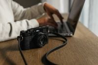 Kaboompics - Camera and Laptop in Home Photography Workspace