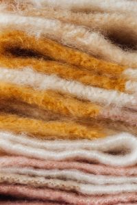 Kaboompics - Stack of Neutral and Pink Blankets