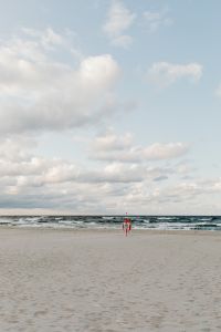 Kaboompics - Vertical Cloudy Sky over Baltic Sea and Sandy Beach with Red Marker, Coastal Wallpaper