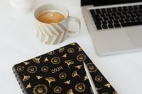 Kaboompics - Coffee Break at the Laptop with a Black Floral 2020 Planner