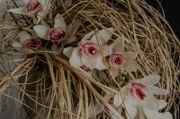 Kaboompics - Close-Up White Orchids Woven Through Dried Grass