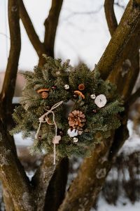 Natural Winter Wreath in Snow With Pine Cones and Dried Orange Slices
