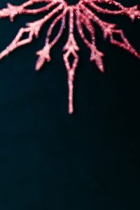 Kaboompics - Glittering Pink Snowflake Ornament Detail on Navy Background