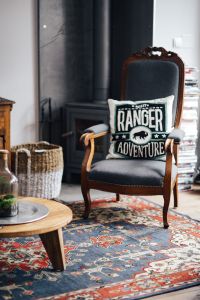 Kaboompics - Vintage Armchair with Graphic Pillow and Living Room Decor