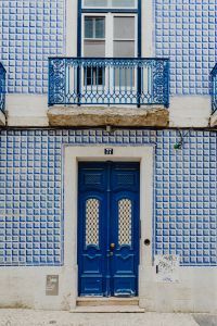 Kaboompics - Colorful wooden door in the facade of a typical Portuguese house at Lisbon, Portugal