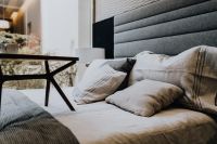 Kaboompics - Neutral Bedroom Pillows and Textured Bedding, Soft Interior Detail