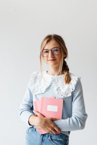 Kaboompics - 12-Year-Old Schoolgirl Holding Notebook and Wearing Glasses