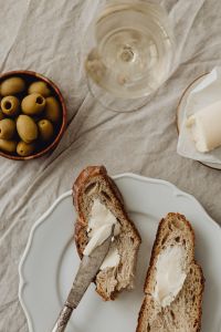 Kaboompics - White Wine, Butter, and Bread Tabletop