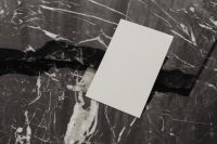 Kaboompics - Diagonal Blank Business Card on Black Marble, Close-Up Stationery Mockup