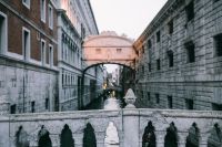 Kaboompics - Historic Venice Canal Bridge with Gondolas and Waterfront Buildings