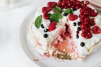 Kaboompics - Close-Up of Cut Pavlova Filled with Berries and Soft Meringue Crumbs
