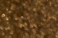 Kaboompics - Low-Light Gold Glitter With Hexagonal Light Circles