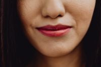 Kaboompics - Close-Up of Soft Red Lipstick on Asian Woman's Lips and Lower Face