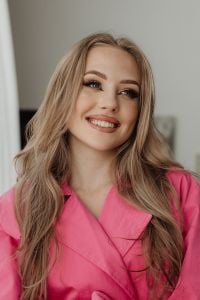 Kaboompics - Smiling Woman in a Pink Barbiecore Blazer