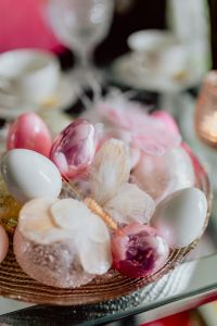 Kaboompics - Close-Up of Pink, White and Lilac Easter Eggs with Soft Feathers in a Decorative Bowl