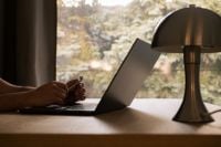 Kaboompics - Laptop and Table Lamp on a Warm Home Office Desk