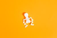 Kaboompics - Single Mini Skeleton on Orange Background