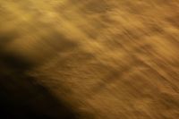Kaboompics - Soft Gold Motion Blur with a Dark Center, Wide Abstract Background Texture