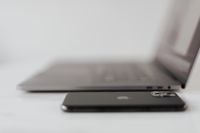 Kaboompics - MacBook Pro 15 laptop and iPhone 11 Pro on a marble table