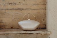 Kaboompics - Minaudière in the shape of a pearl bead
