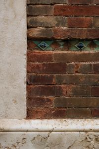 Kaboompics - Spanish Brick Wall and Decorative Tile Stripe