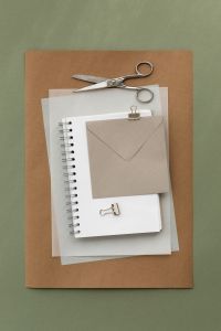 Kaboompics - Analogue Stationery Flat Lay with Notebook Envelope and Scissors