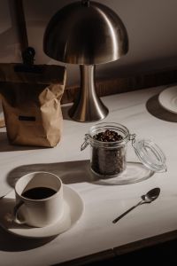 Kaboompics - Moody Coffee Beans, Paper Bag and Table Lamp Still Life