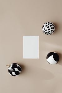 Kaboompics - White Christmas Card Mockup with Neutral Baubles on a Beige Background