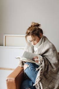 Kaboompics - Quiet Stay-at-Home Moment: Woman Reading in a Blanket