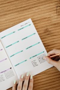 Kaboompics - April Bullet Journal Calendar on Wooden Desk