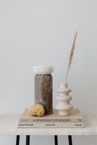 Beige Travertine Still Life with Candles, Vases and Dried Flowers
