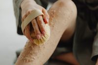 Kaboompics - Dry Body Brushing a Leg with Exfoliating Salt Scrub