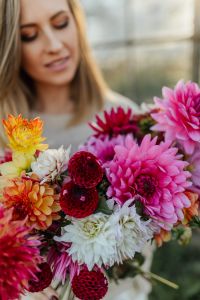 Kaboompics - Woman With Colorful Dahlia Bouquet At Greenhouse