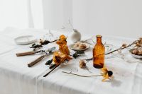 Kaboompics - Neutral Dried Flower Still Life with Amber Bottle, Ceramic Vase and Shears