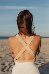 Kaboompics - Woman in a Beige Open-Back Top at the Beach at Sunset