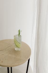 Kaboompics - Pink Rosemary Cocktail on White Fabric