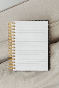 Kaboompics - Close-Up Lined Notebook Page with Gold Spiral Binding