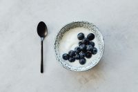 Kaboompics - Overhead Yogurt with Blueberries and Black Spoon