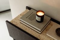 Kaboompics - Black Console with Open Drawer, Travertine Top and Silver Lamp