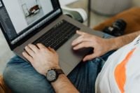 Kaboompics - Close-Up of Photographer Editing Images on Laptop