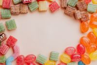 Kaboompics - Sugar-Coated Gummy Candy Border with Wide Blank Center, Food Text Background
