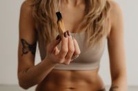 Kaboompics - Close-Up of a Hand Holding a Smoking Palo Santo Stick