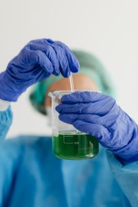 Kaboompics - Researcher Preparing Green Reagent in Glass Beaker