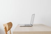 Kaboompics - Minimal Silver Laptop on Pale Wood Desk with Blank Wall, Home Office Mockup Copy Space