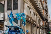 Kaboompics - Blue SSC Napoli Flags Outside a Historic Naples Storefront
