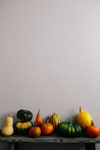 Kaboompics - Vertical Pumpkin Arrangement on Rustic Table
